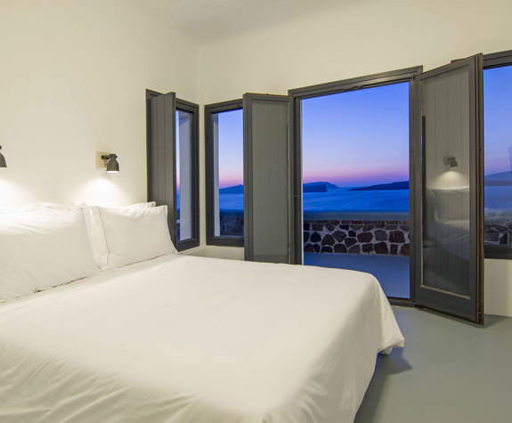 Grand Ambassador Santorini Hotel Villa double bed and balcony view