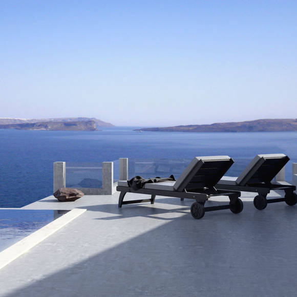 Grand Ambassador Santorini Infinity Honeymoon Cave Suite sun terrace with loungers and sea views