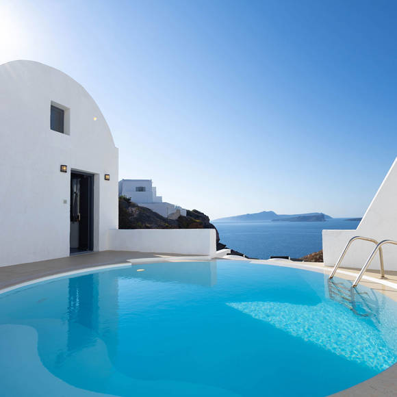 Grand Ambassador Santorini Serenity Two Bedroom Suite private pool terrace with white Cycladic architecture and panoramic sea views