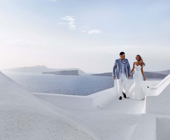 Grand Ambassador Santorini Hotel visitors walking a white path