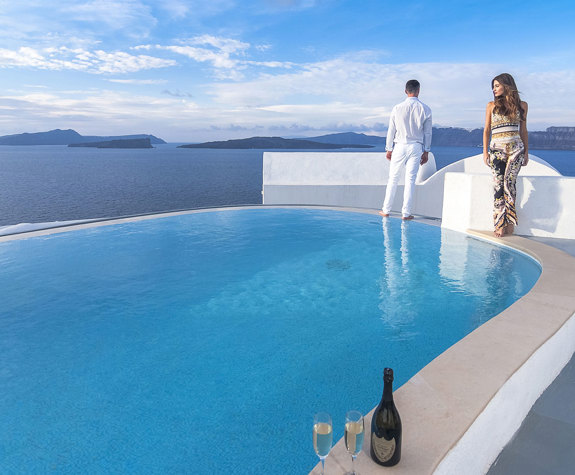 Grand Ambassador Santorini Hotel visitors next to the pool